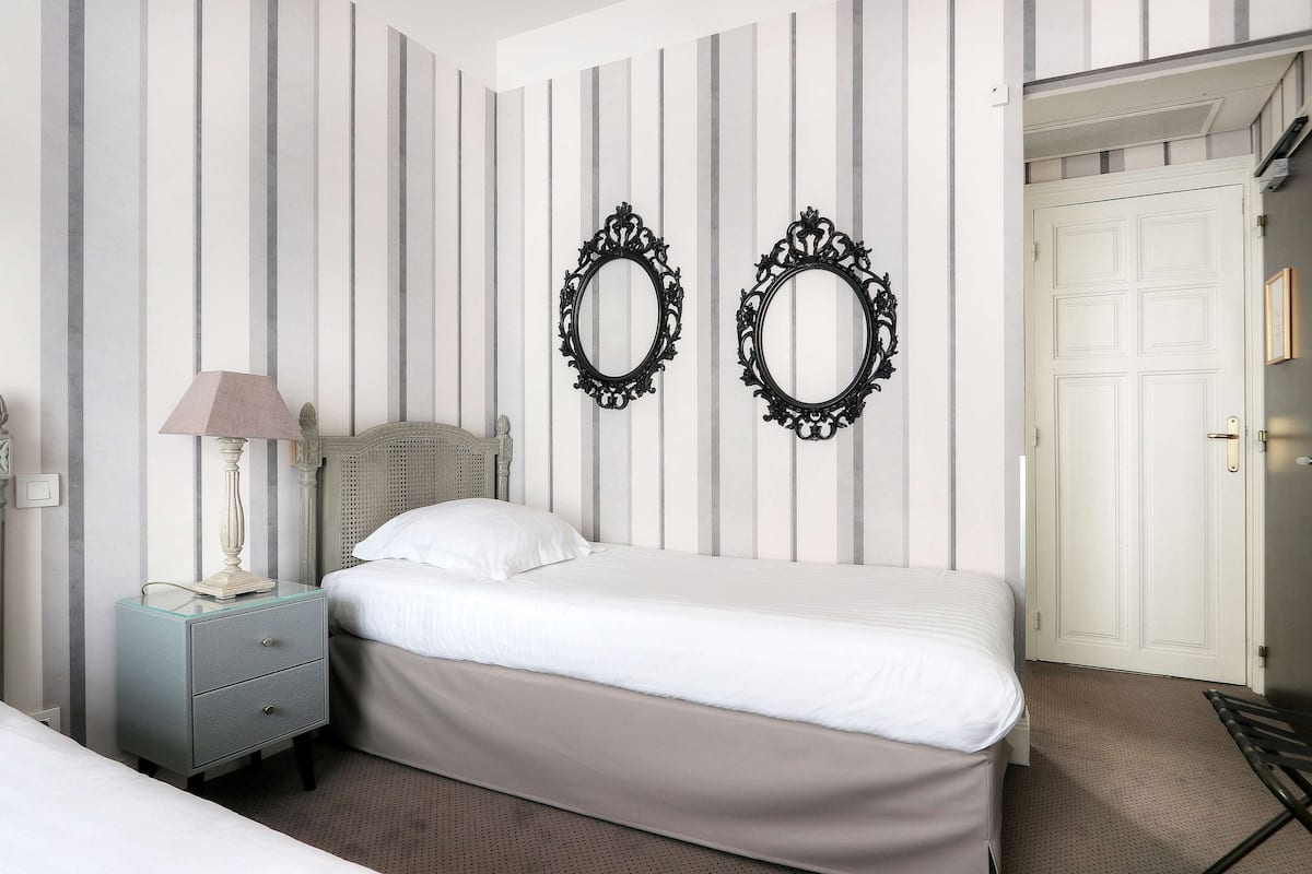 standard room, multiple beds, bathtub | in-room safe, desk, soundproofing, iron/ironing board