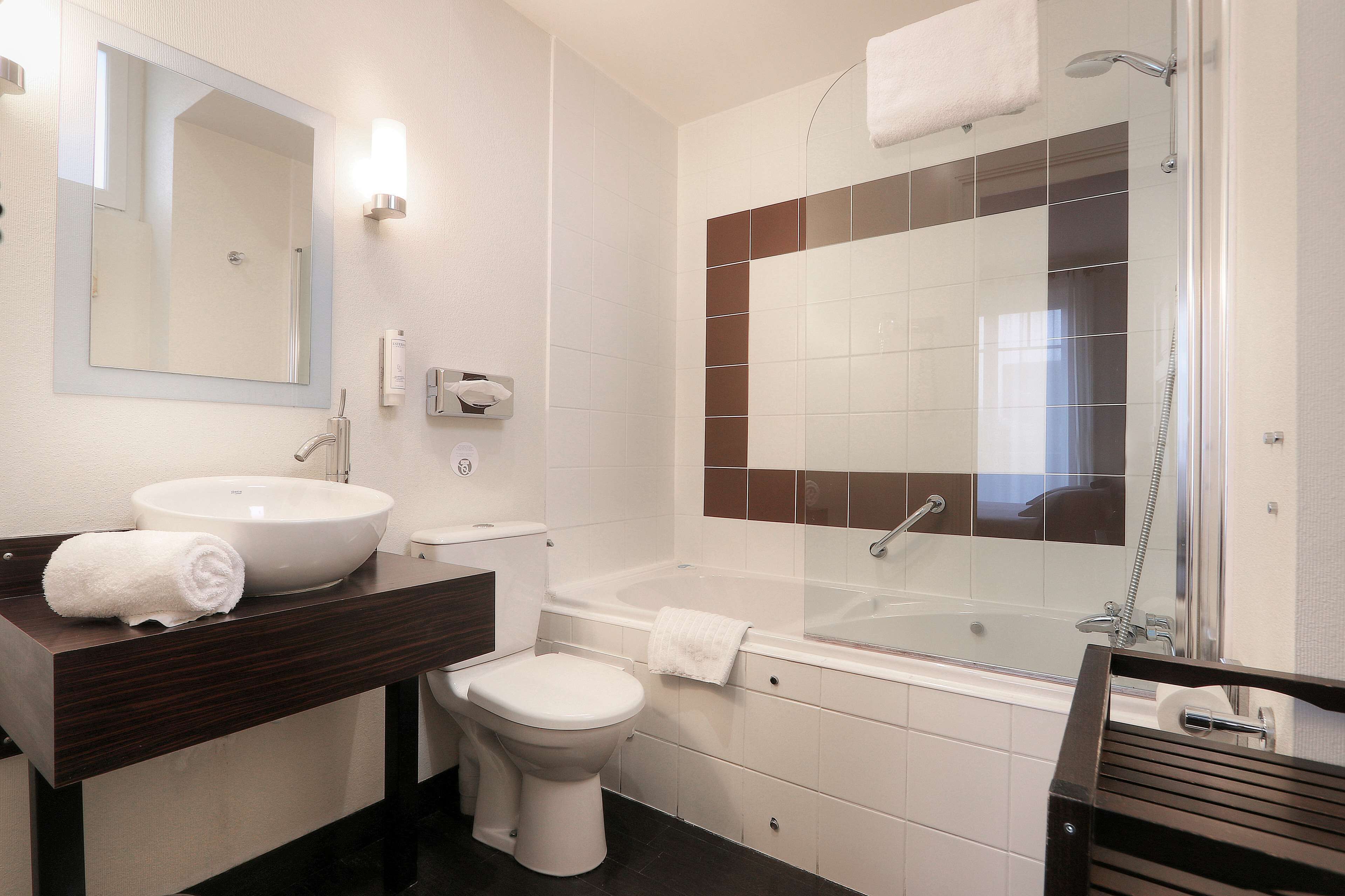 comfort room, 1 queen bed, bathtub (larger room) | bathroom | hair dryer, towels