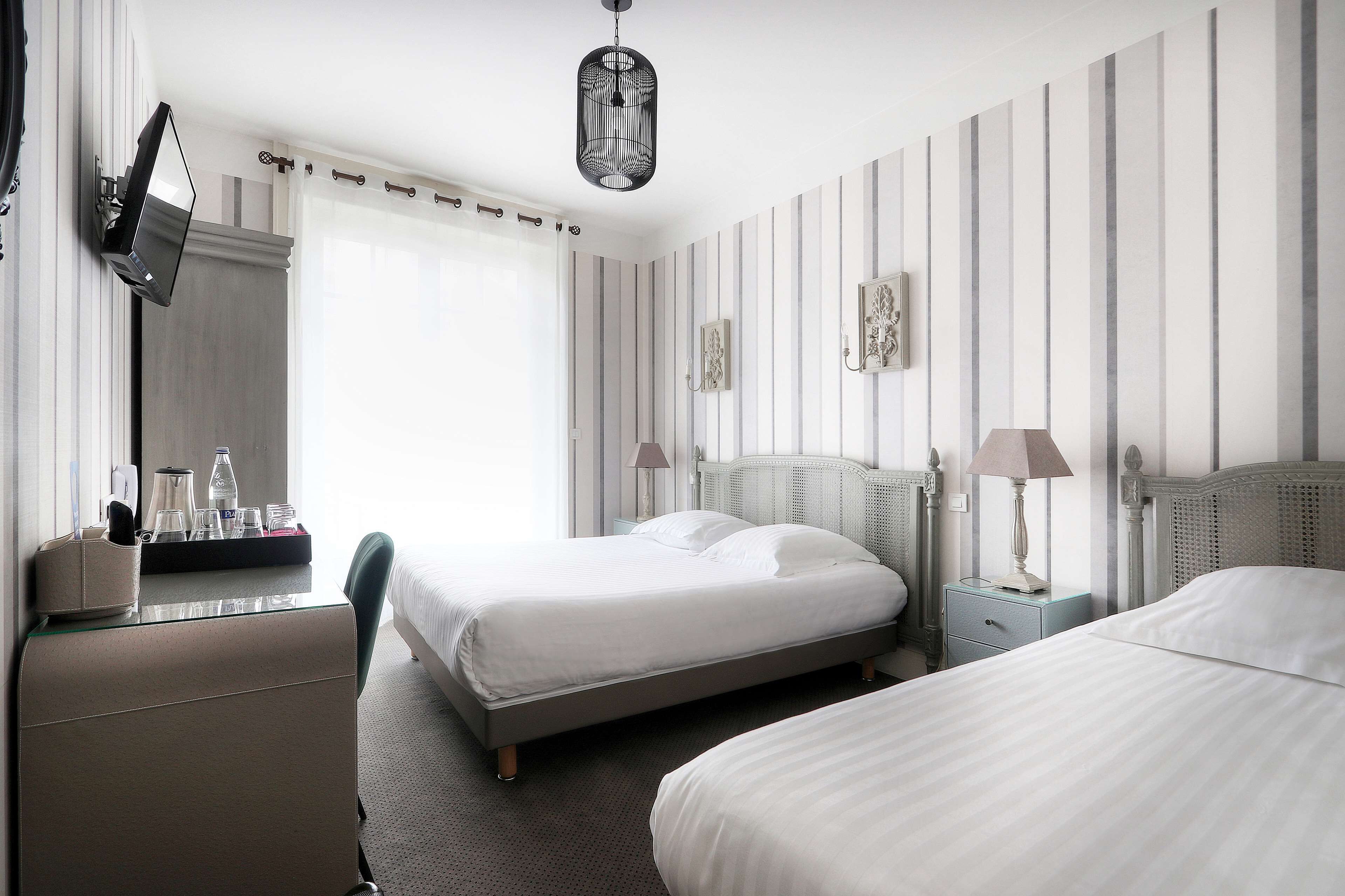 standard room, multiple beds, bathtub | in-room safe, desk, soundproofing, iron/ironing board