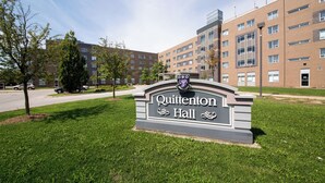 A sign for Quittenton Hall with a clear view of the building's brick facade and windows. - Residence & Conference Centre - Windsor (Windsor)
