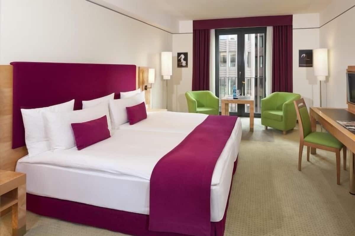 Hypo-allergenic bedding, down duvets, in-room safe, desk