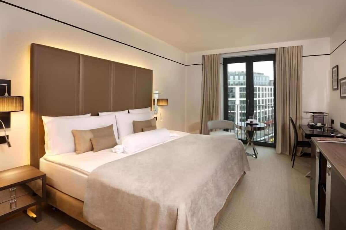 Hypo-allergenic bedding, down duvets, in-room safe, desk