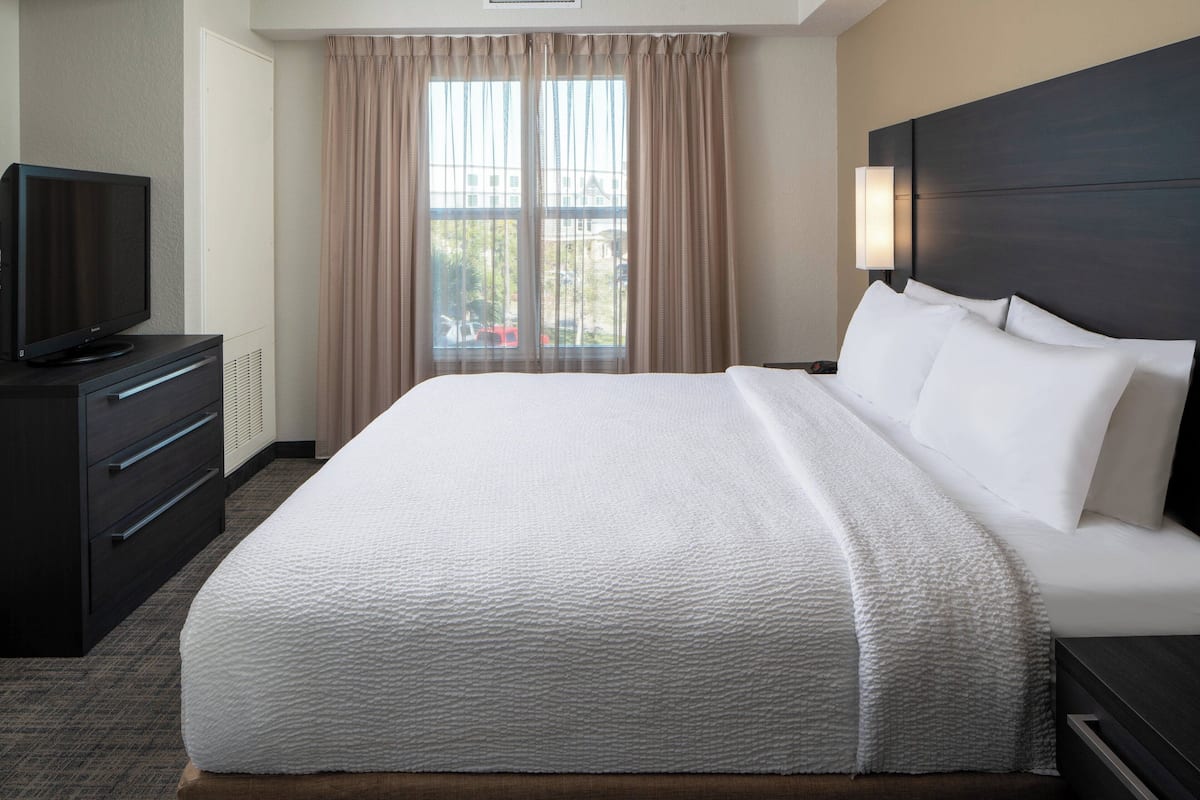 Premium bedding, desk, laptop workspace, blackout curtains