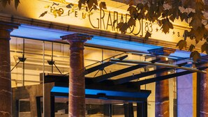 A building entrance with large columns, a glass door, and a sign with the number 83. - Hotel Granados 83, a member of Preferred Hotels & Resorts (Barcelona)