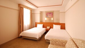 A hotel room with two beds, a large window with curtains, a bedside table with a lamp, and a wall-mounted artwork. - Hotel Tetora Otsu Kyoto (Otsu)