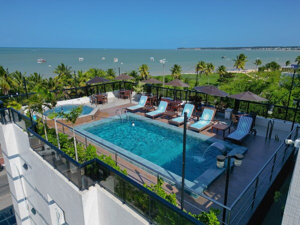 Outdoor pool, pool umbrellas, pool loungers