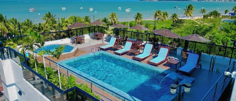 Outdoor pool, pool umbrellas, sun loungers