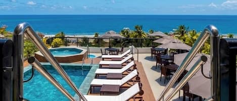 Outdoor pool, pool umbrellas, pool loungers