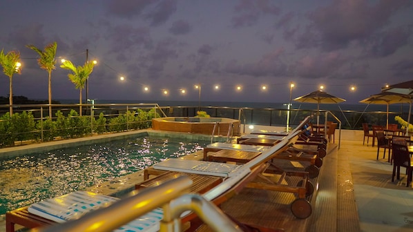 Outdoor pool, pool umbrellas, pool loungers
