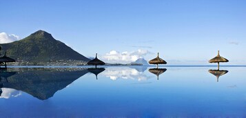 Outdoor pool, pool umbrellas, sun loungers