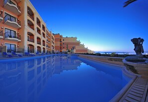 Indoor pool, seasonal outdoor pool, open 10 AM to 7 PM, pool umbrellas