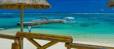 On the beach, white sand, free beach cabanas, sun loungers