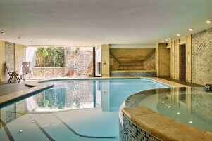 Seasonal outdoor pool, open 8:00 AM to 7:00 PM, pool umbrellas