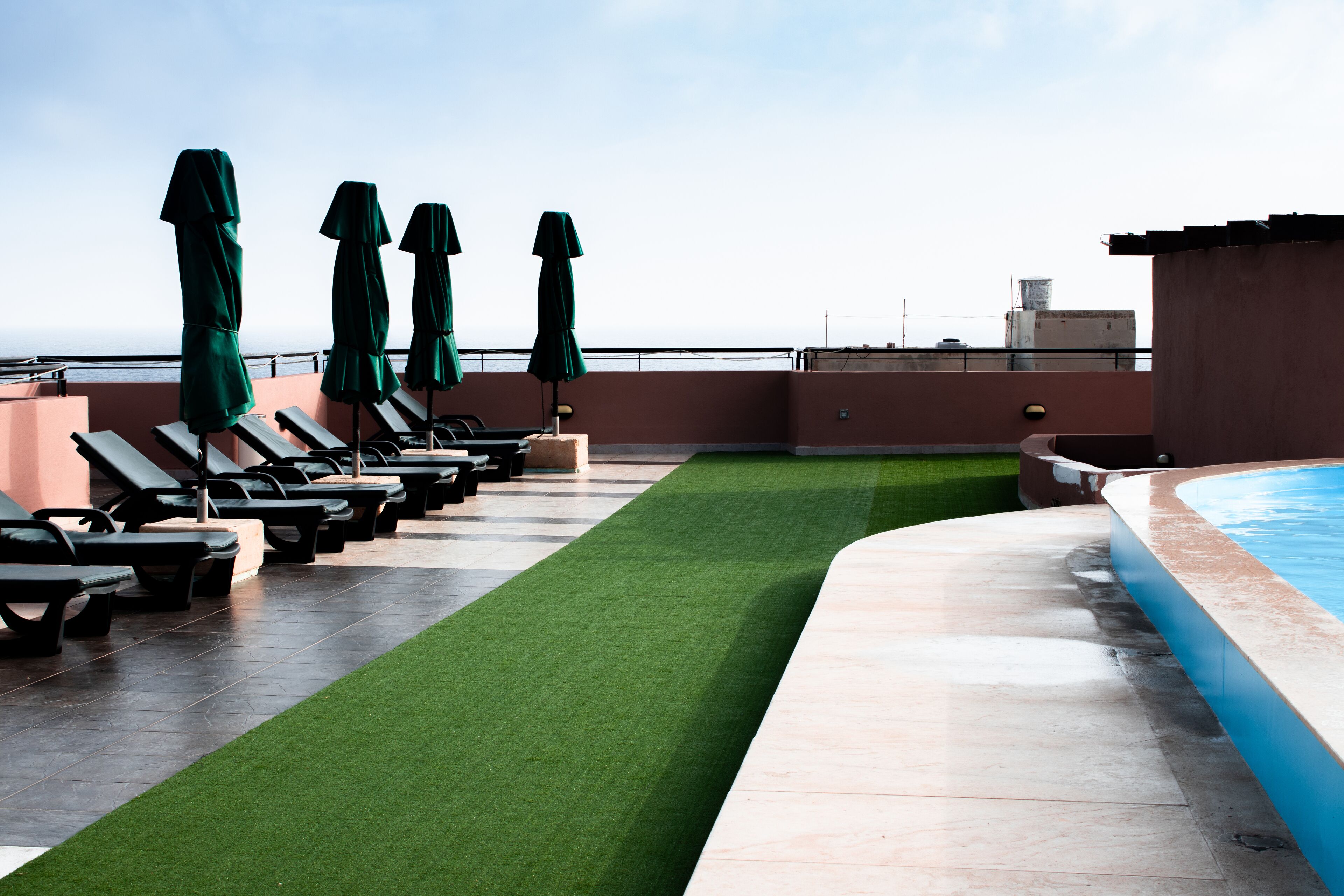 seasonal outdoor pool, pool umbrellas, pool loungers