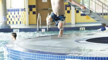 Guests can enjoy a fun-filled day in the pool, complete with a slide and staircase.