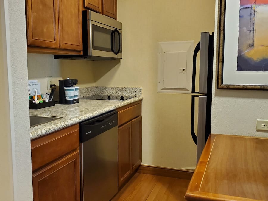 Fridge, microwave, coffee/tea maker, cookware/dishes/utensils