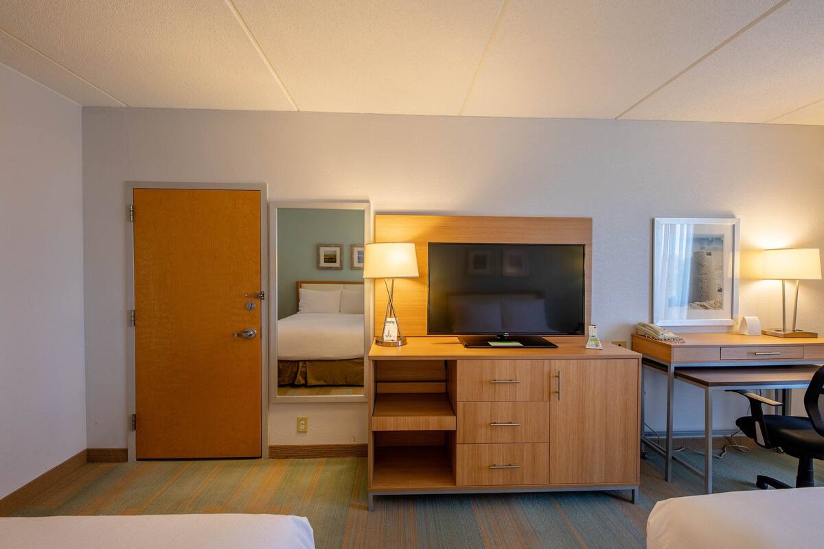 Premium bedding, memory foam beds, desk, laptop workspace