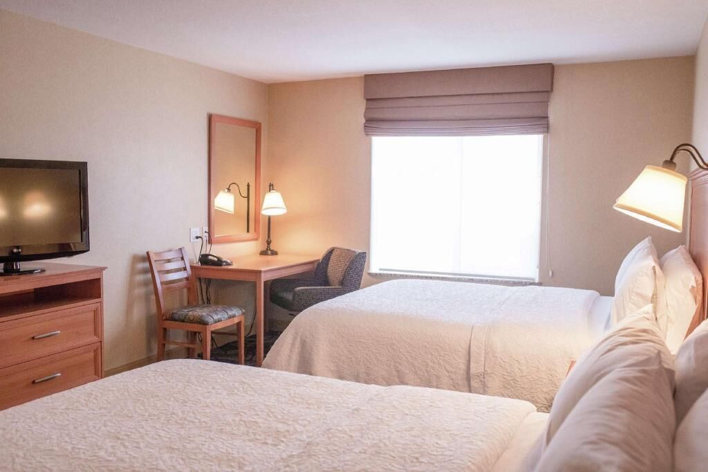 Desk, blackout drapes, iron/ironing board, rollaway beds