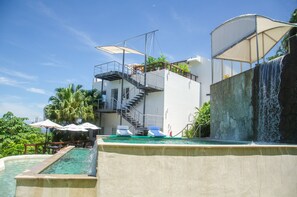 3 outdoor pools, open 7:00 AM to 10:00 PM, pool umbrellas, pool loungers
