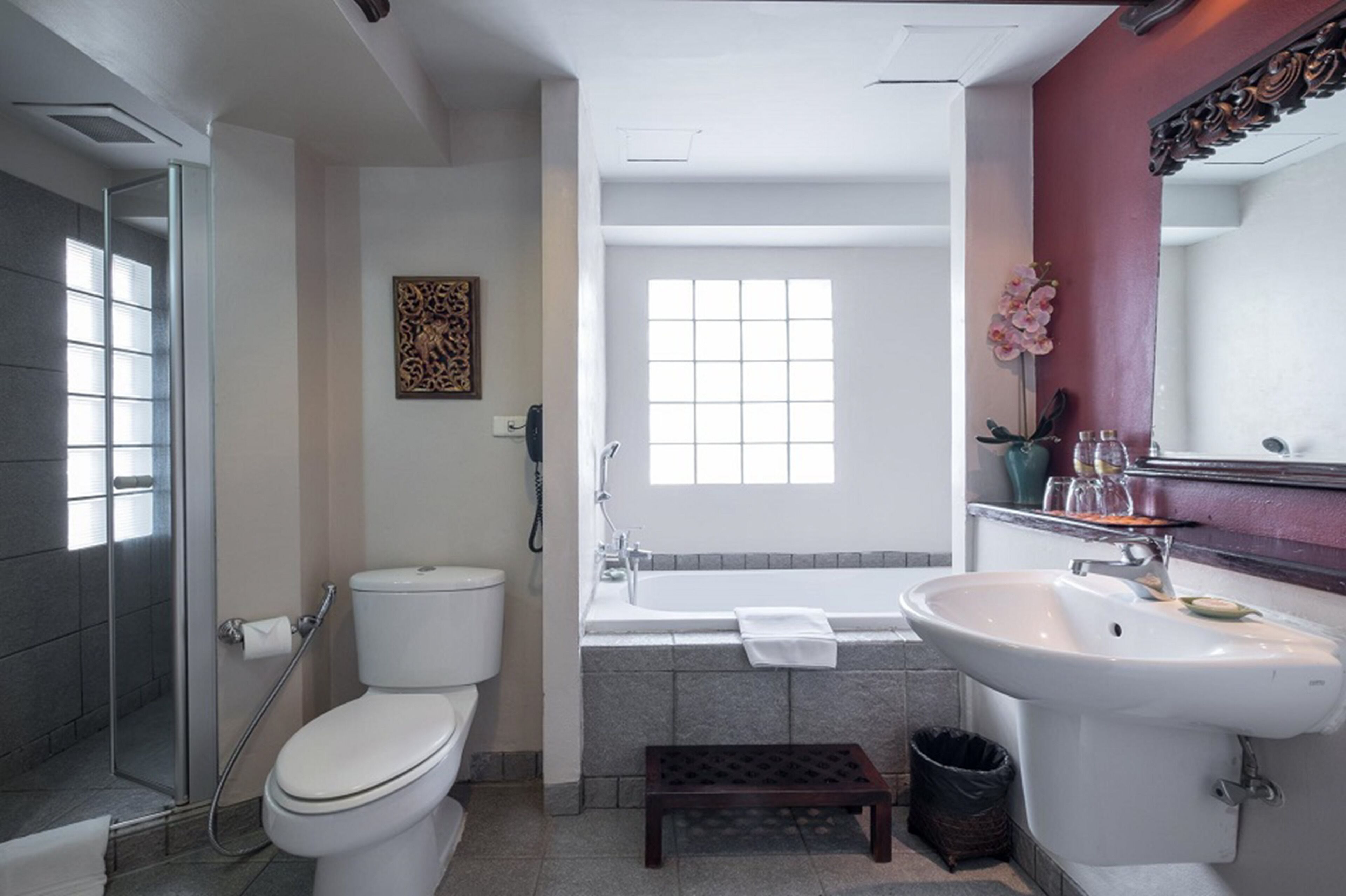 executive suite | bathroom | rainfall showerhead, free toiletries, hair dryer, bathrobes