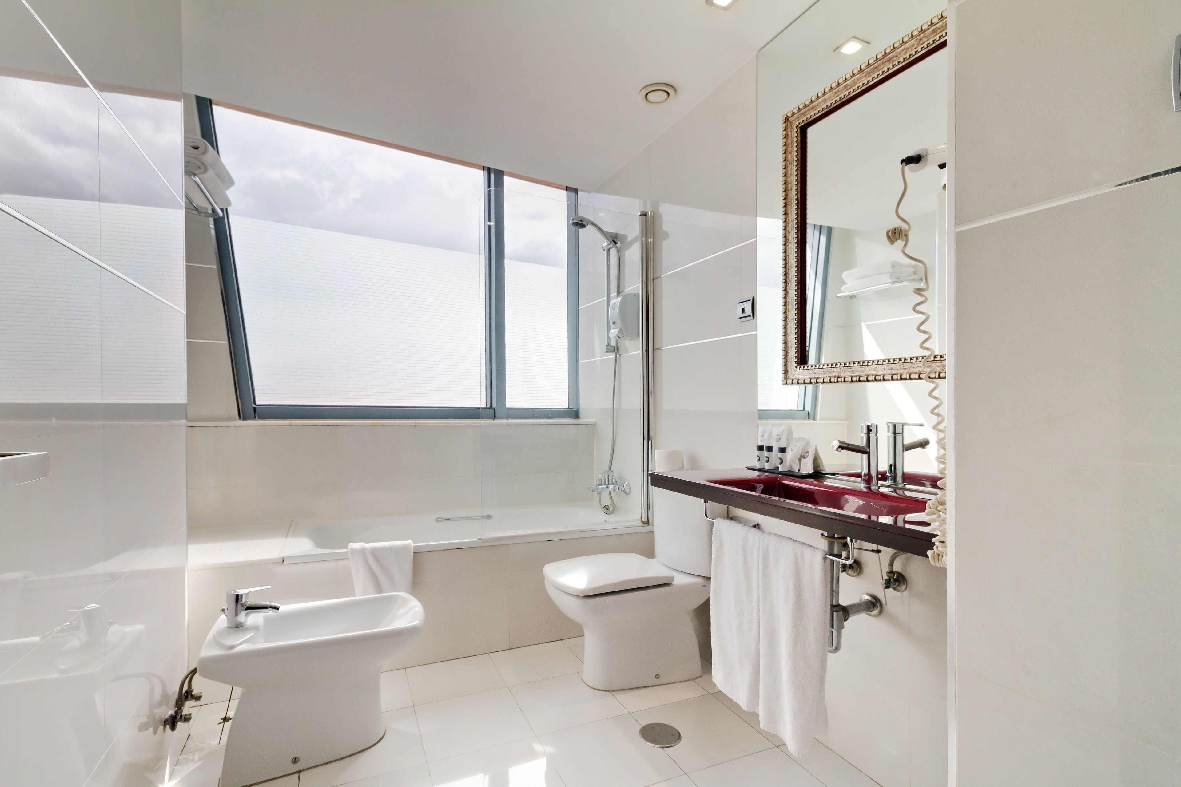 designer toiletries, hair dryer, towels, soap