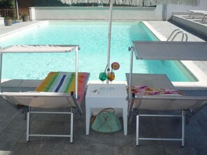 Outdoor pool, pool umbrellas, sun loungers