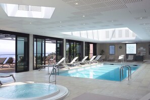 Indoor pool, open 7:30 AM to 8:30 PM, pool loungers