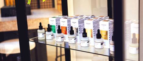 A display of skincare products on shelves in a store.