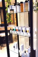 A display of skincare products on shelves in a store.