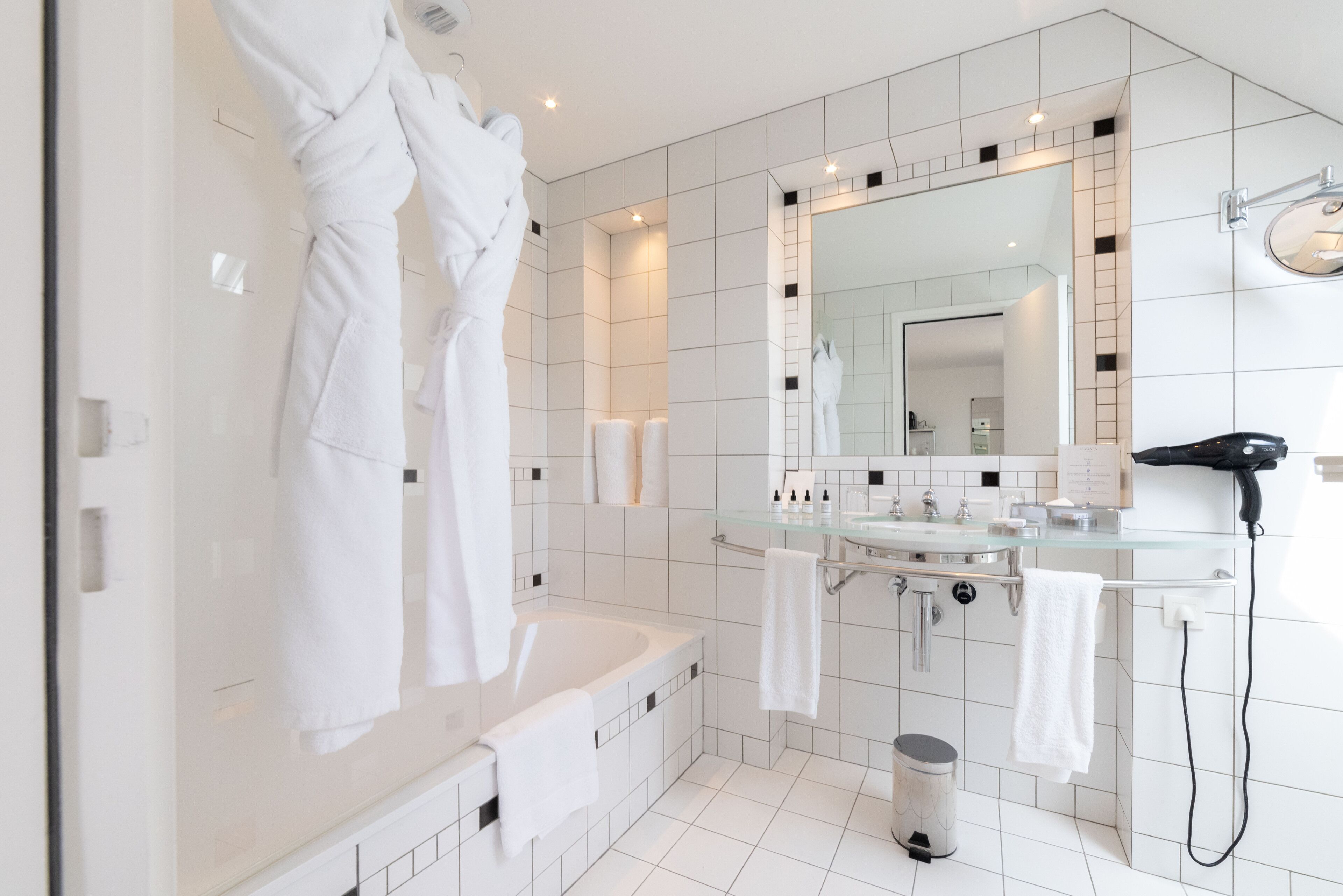 designer toiletries, hair dryer, bathrobes, slippers