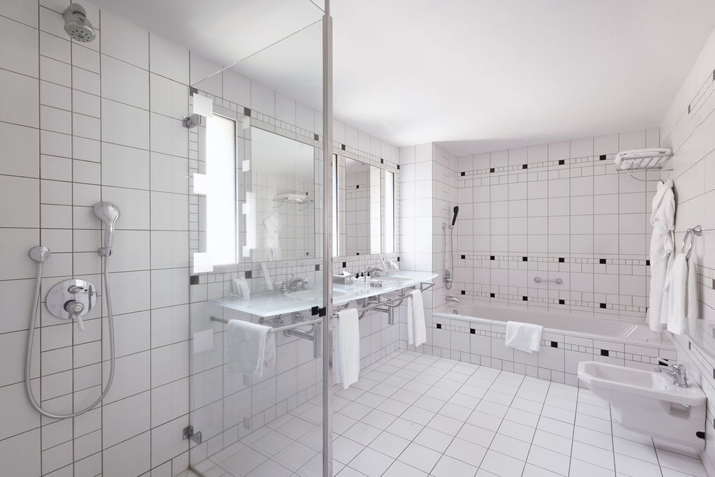 designer toiletries, hair dryer, bathrobes, slippers