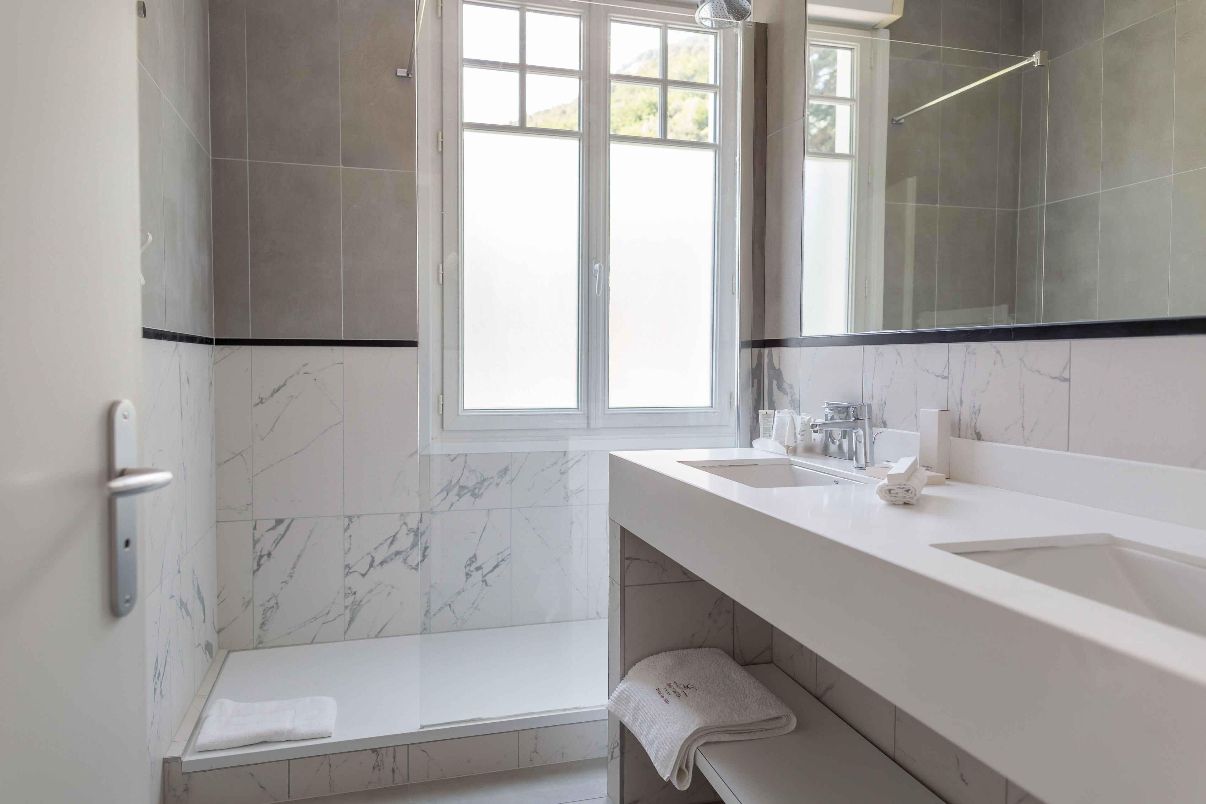 junior suite | bathroom | eco-friendly toiletries, hair dryer, towels, soap