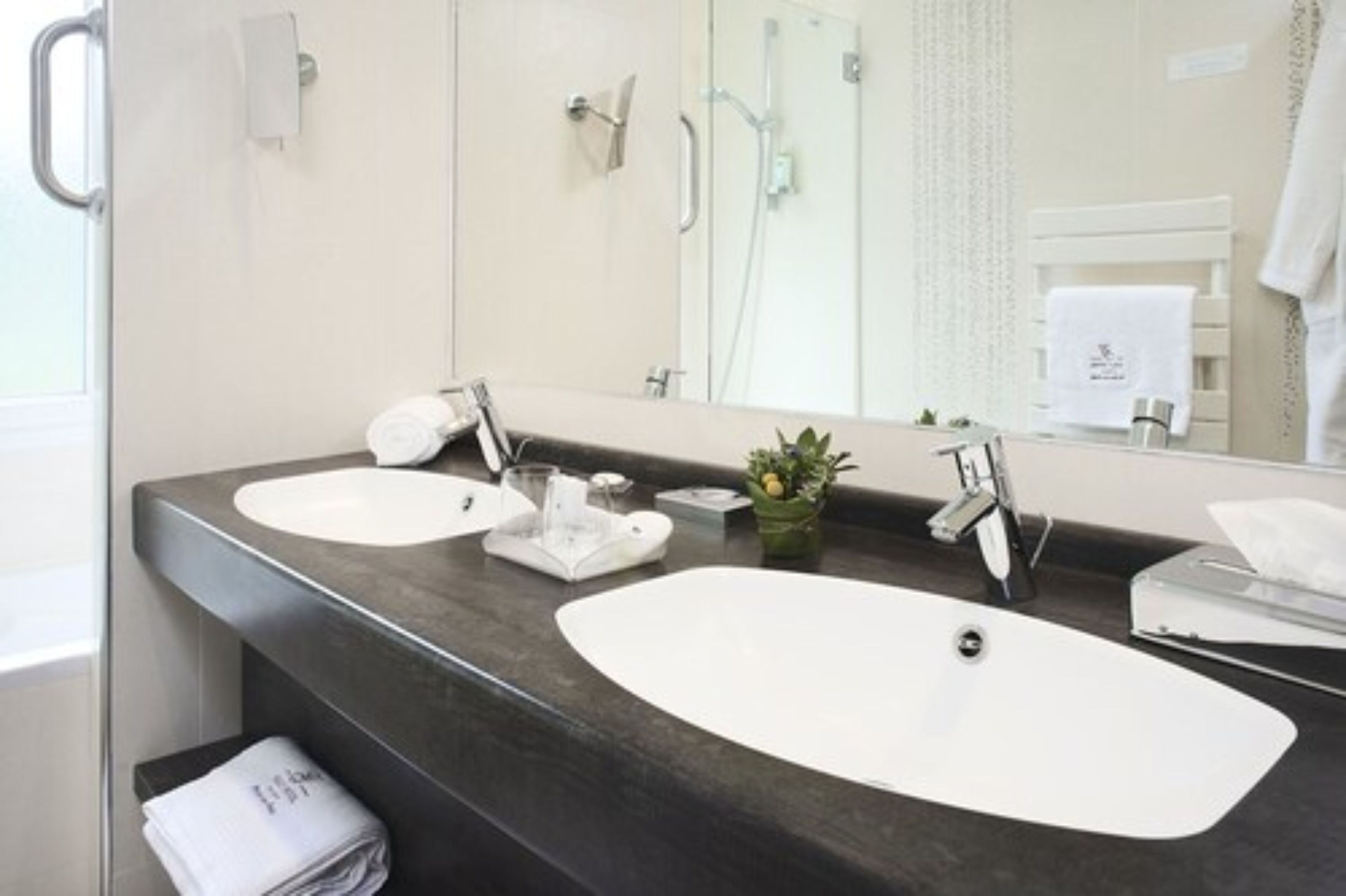 junior suite | bathroom | eco-friendly toiletries, hair dryer, towels, soap