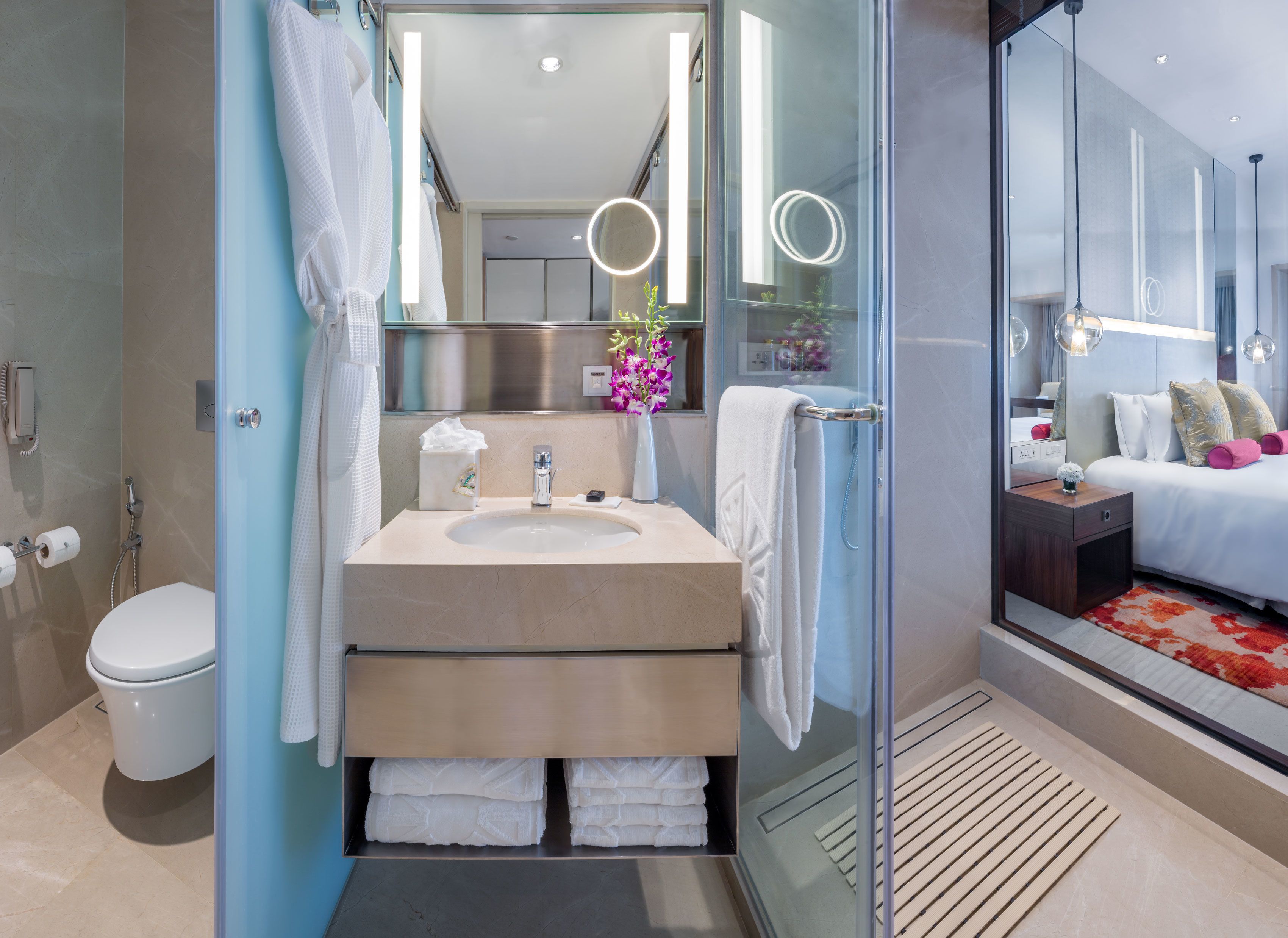 superior room city view | bathroom | shower, designer toiletries, hair dryer, bathrobes