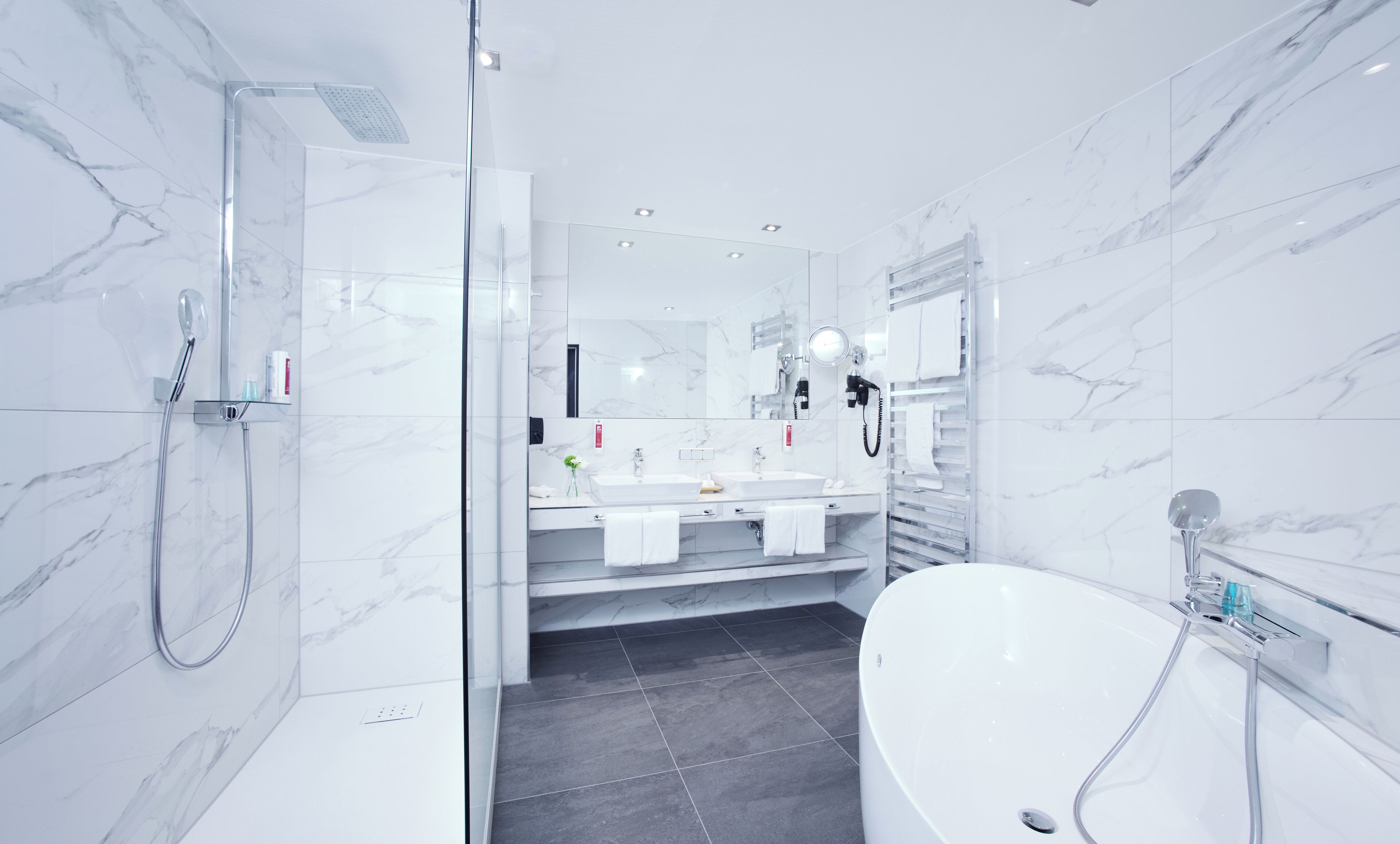 junior studio suite | bathroom | hair dryer, bathrobes, slippers, towels