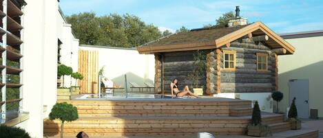 A modern building with a log cabin structure, a swimming pool, and lounge chairs.