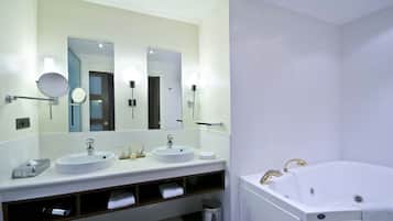 Designer toiletries, hair dryer, slippers, towels