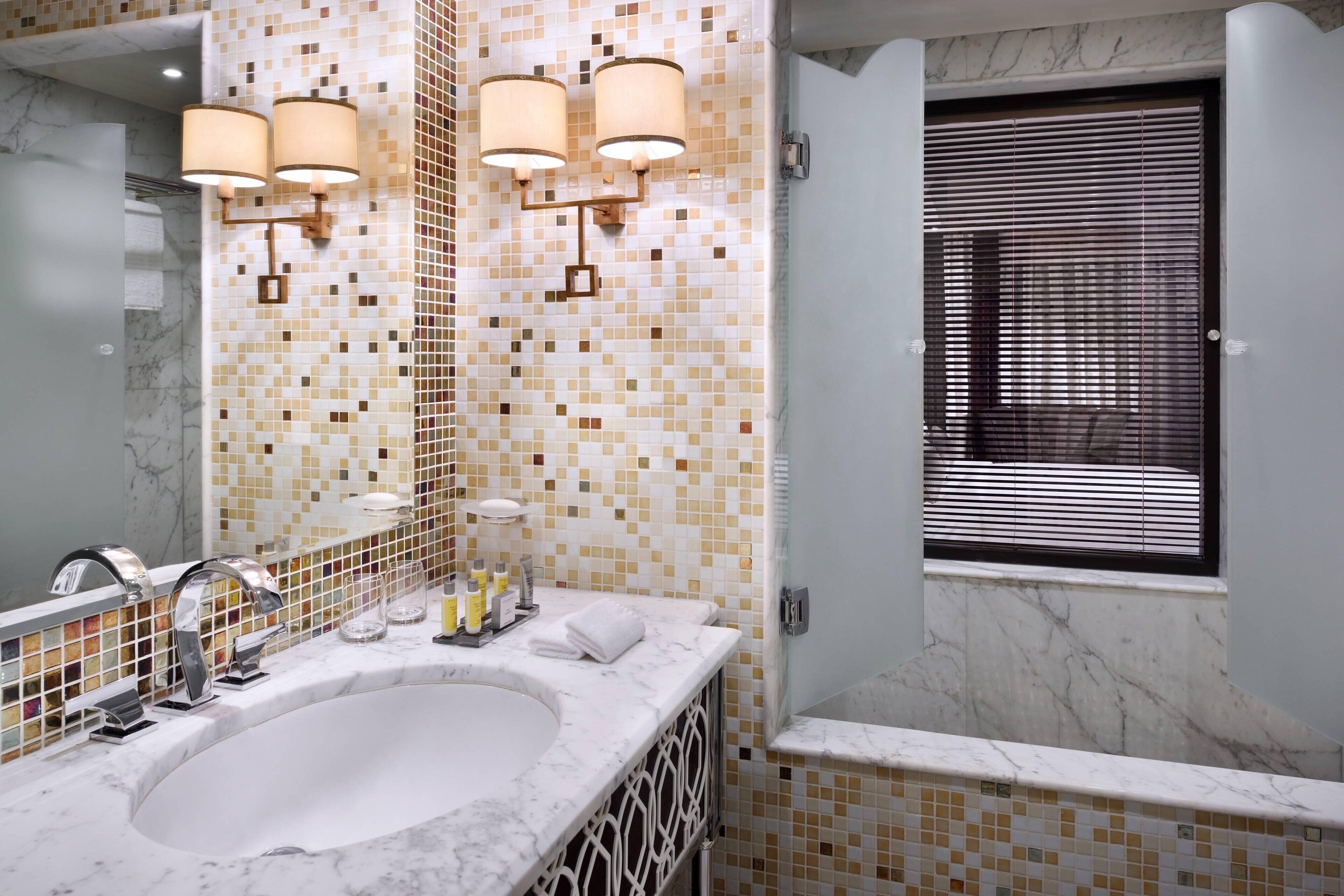 suite, 1 king bed, balcony, pool view | bathroom | shower, free toiletries, hair dryer, bathrobes