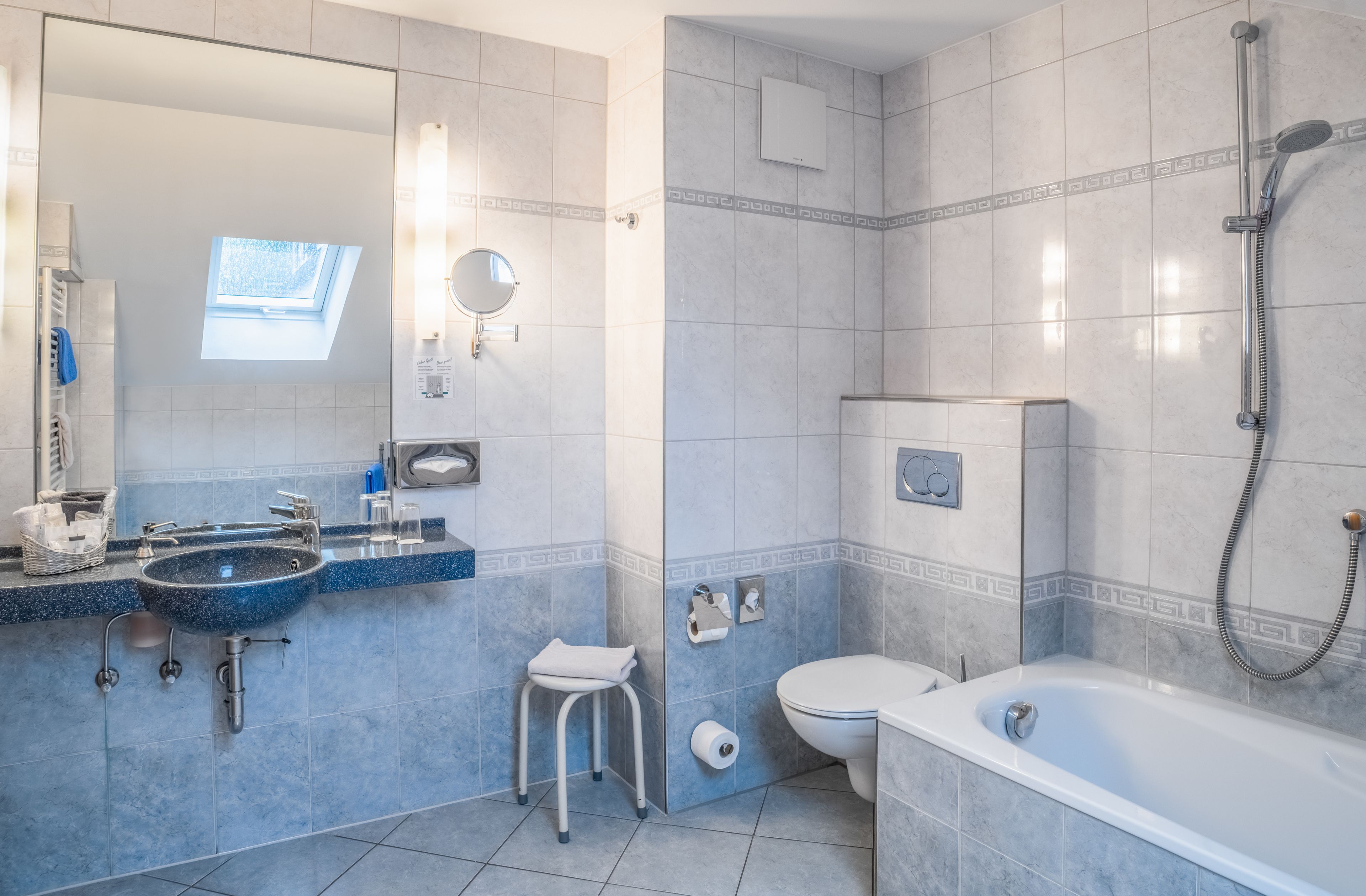 deluxe double room | bathroom | free toiletries, hair dryer, slippers, towels