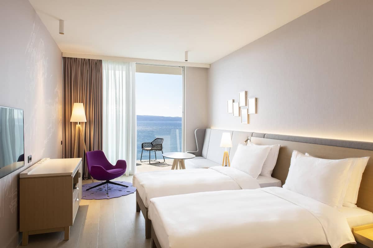 Premium Room, Balcony, Sea View | Hypo-allergenic bedding available, in-room safe, desk, laptop workspace