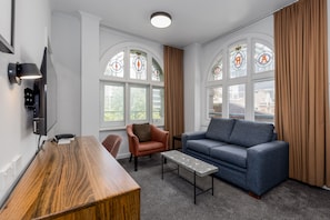 One Bedroom Apartment - Spa  | Living area | 40-inch LED TV with cable channels, TV, iPod dock