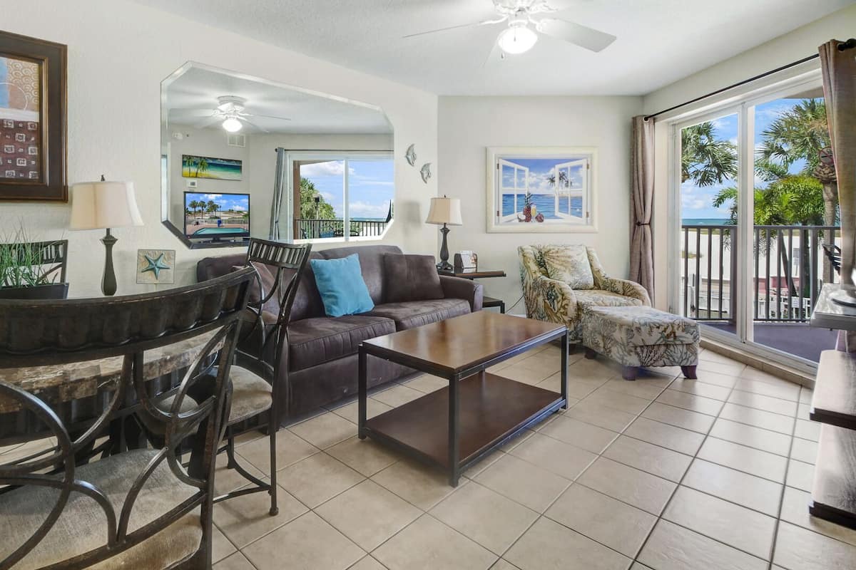 Deluxe Condo, Balcony (Gulf Front) | Living area | Flat-screen TV, DVD player