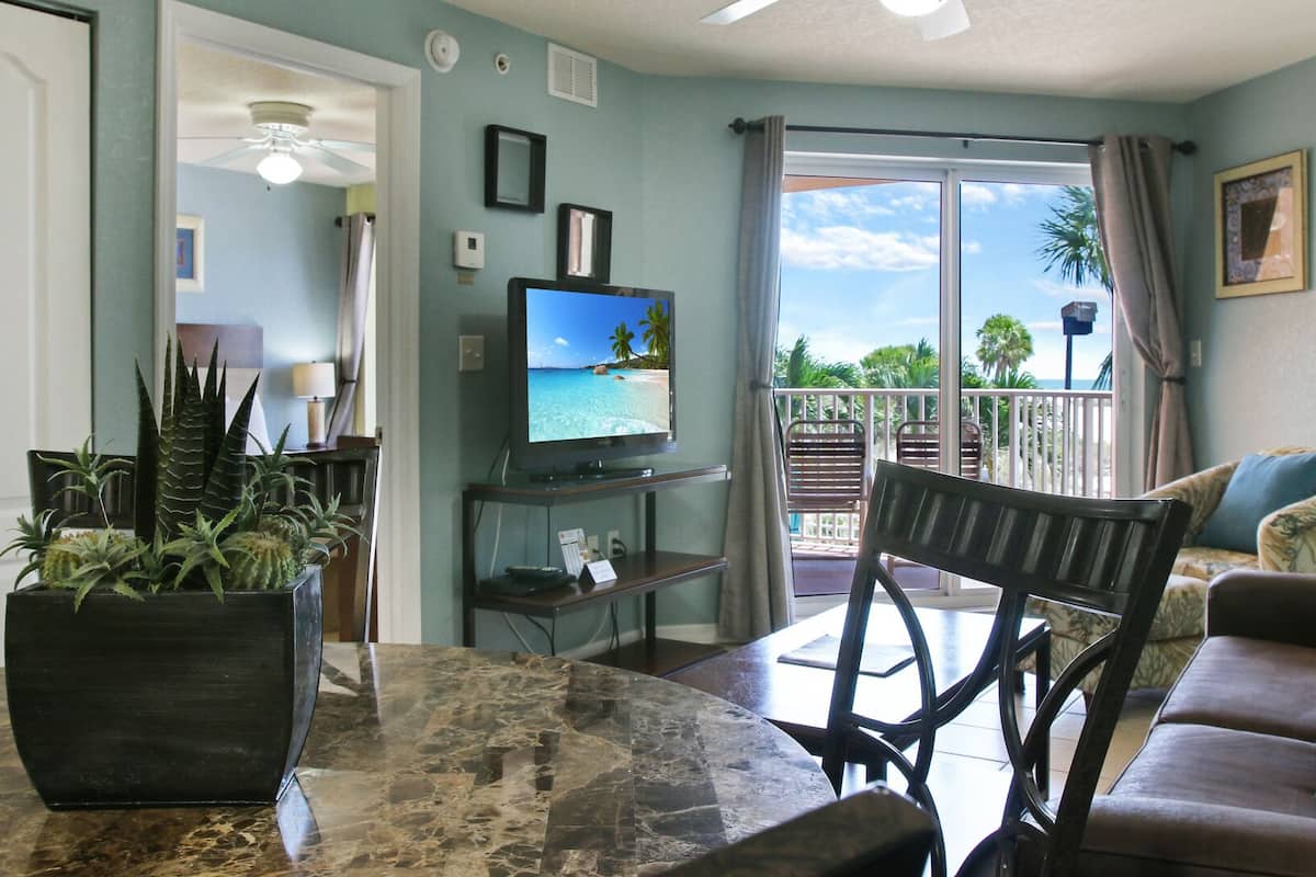 Family Condo, Balcony (Gulf Front) | Living area | Flat-screen TV, DVD player