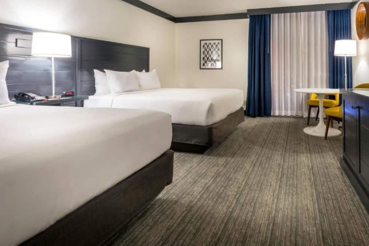 Pool View Room with Double Beds + $5 in slot play & $10 in table games match play | 1 bedroom, in-room safe, desk, laptop workspace