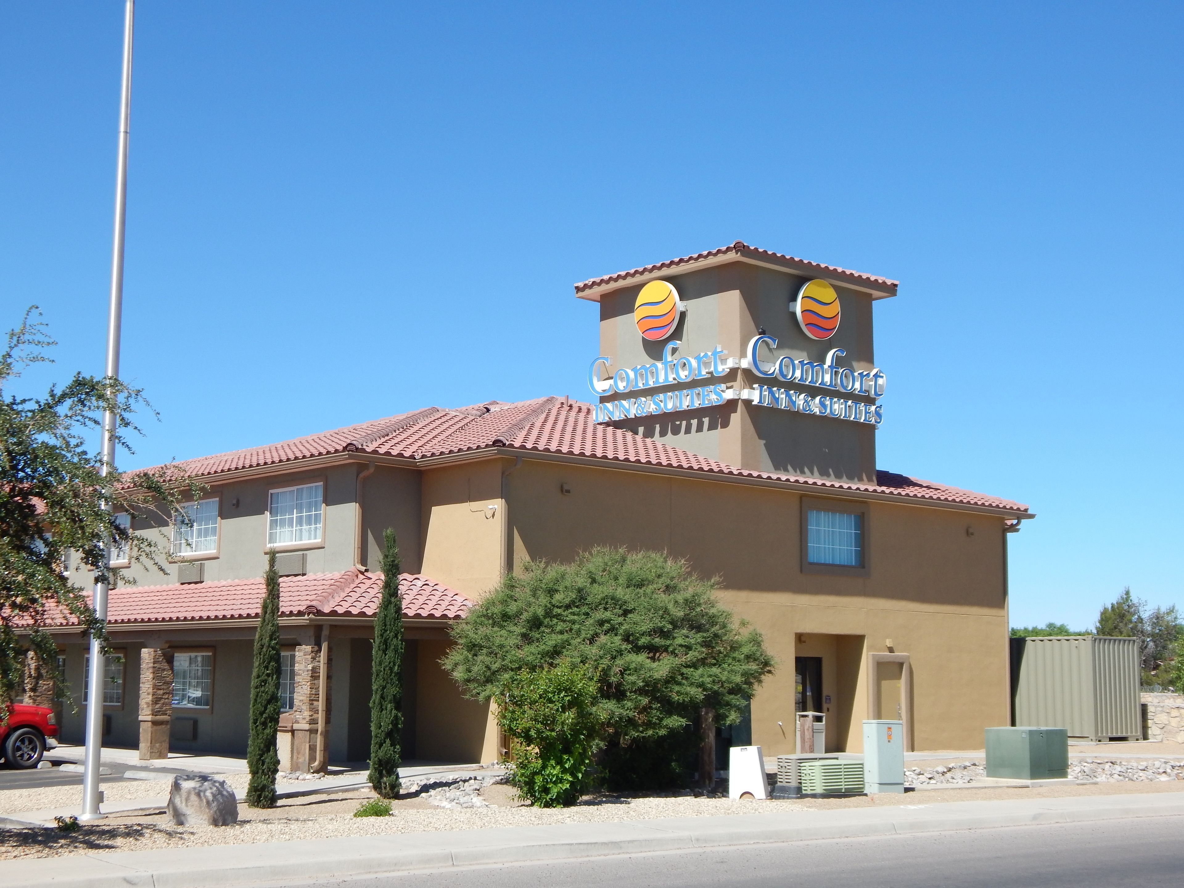 A building with a sign reading "Comfort Inn & Suites."