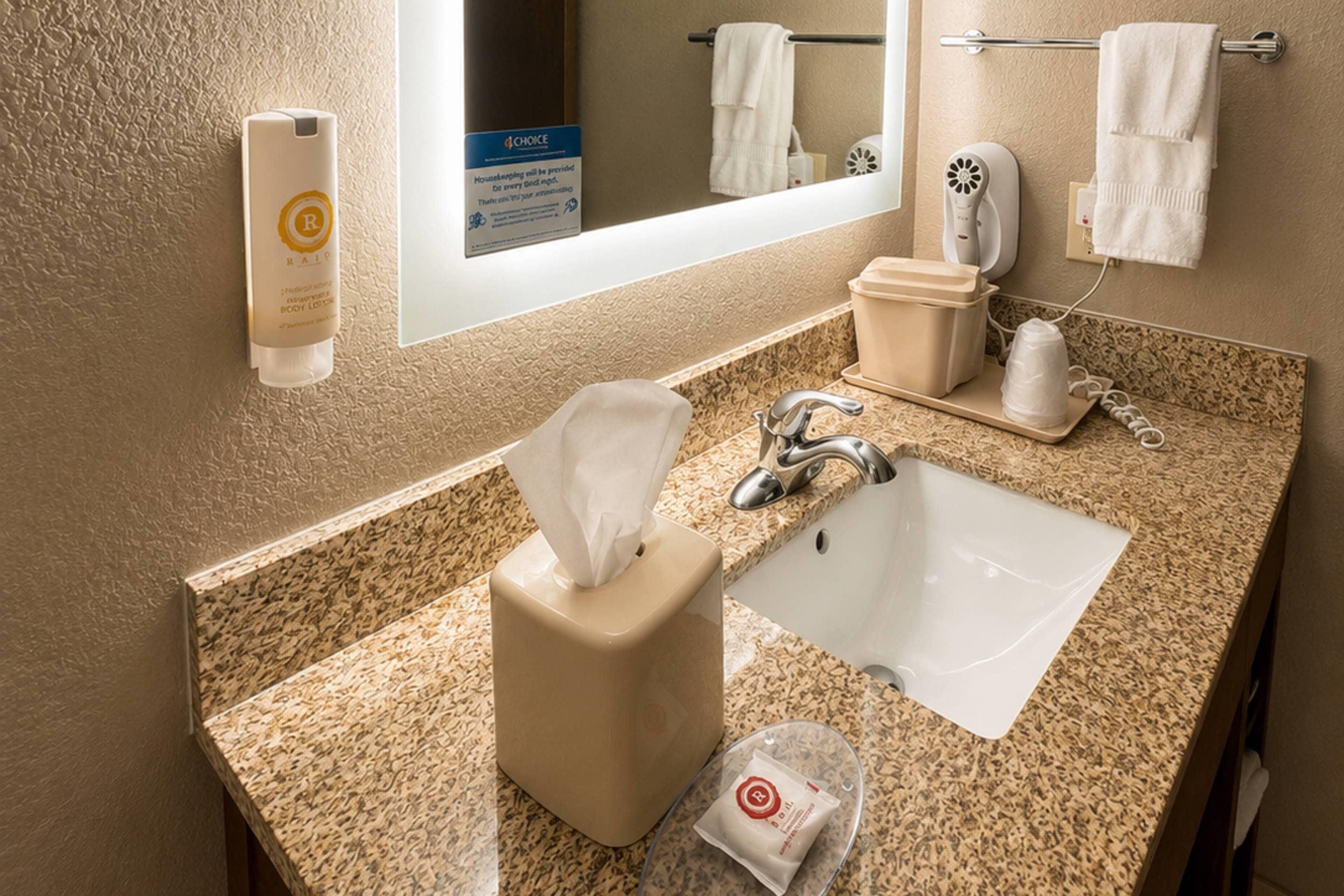 A bathroom with a sink, towel rack, and a mirror.