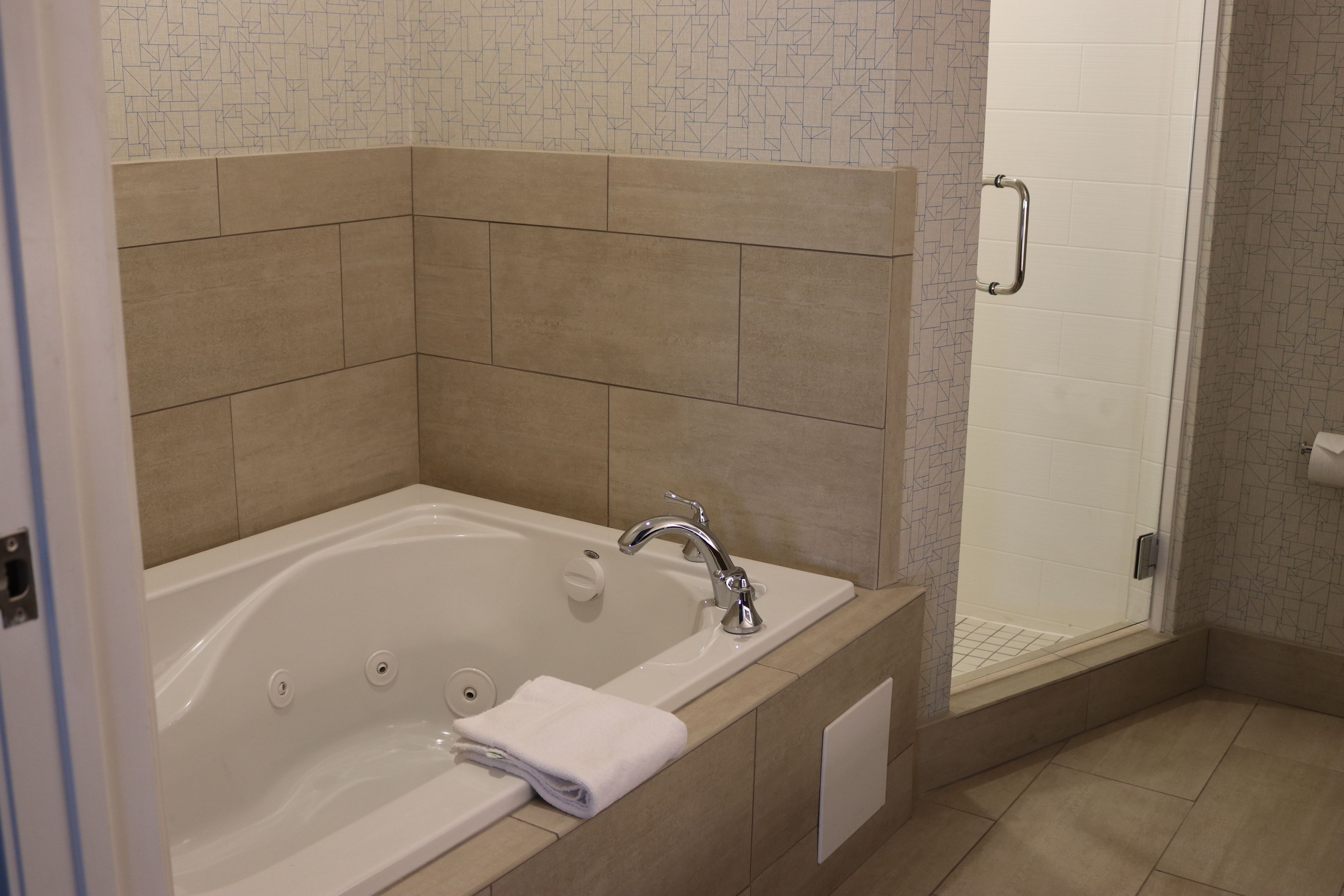 A bathroom with a bathtub, a shower, and a toilet.