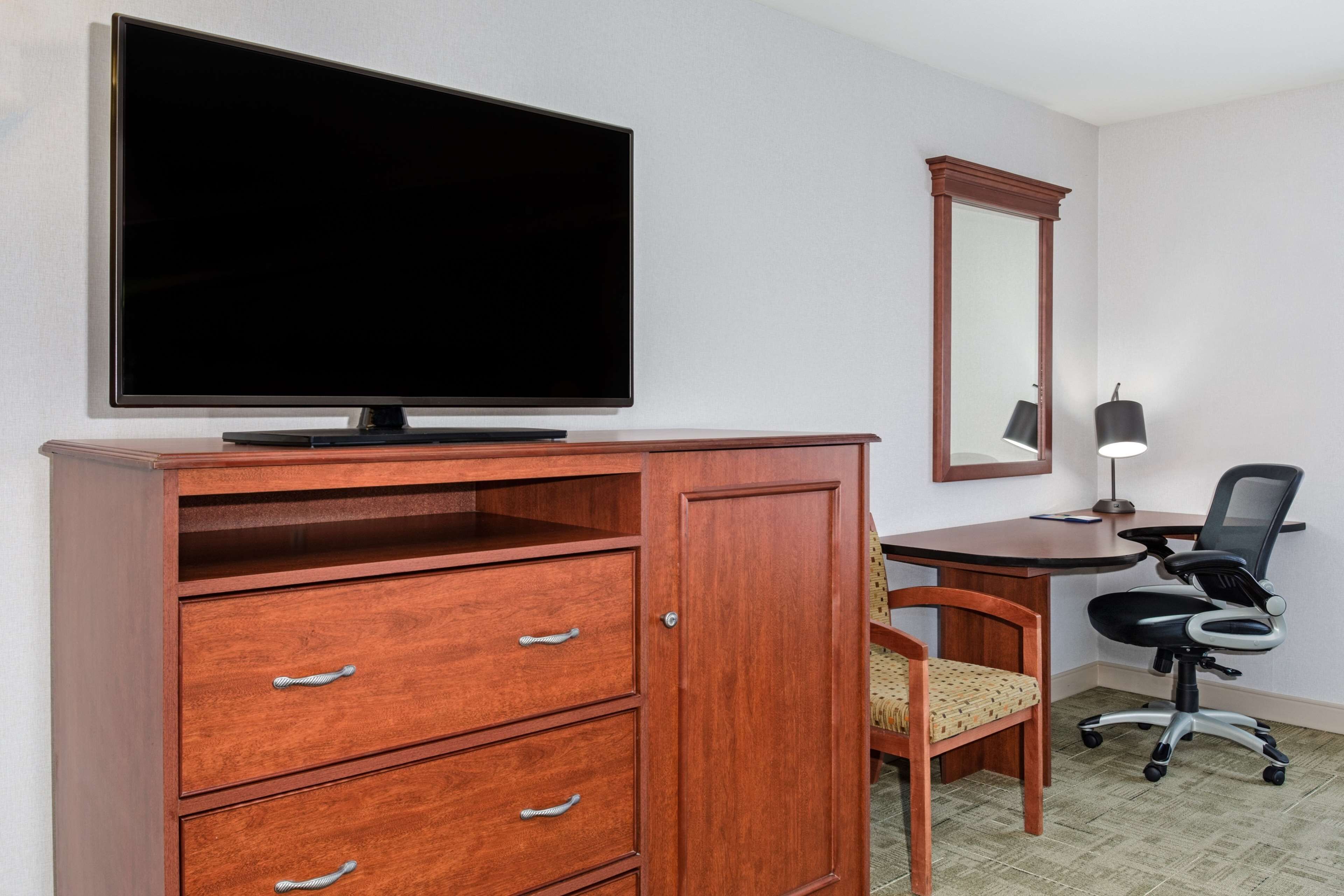 room, 1 king bed, jetted tub | desk, iron/ironing board, free cots/infant beds, free rollaway beds