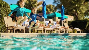 A pool area with lounge chairs and umbrellas. - Tubac Golf Resort & Spa (Tubac)