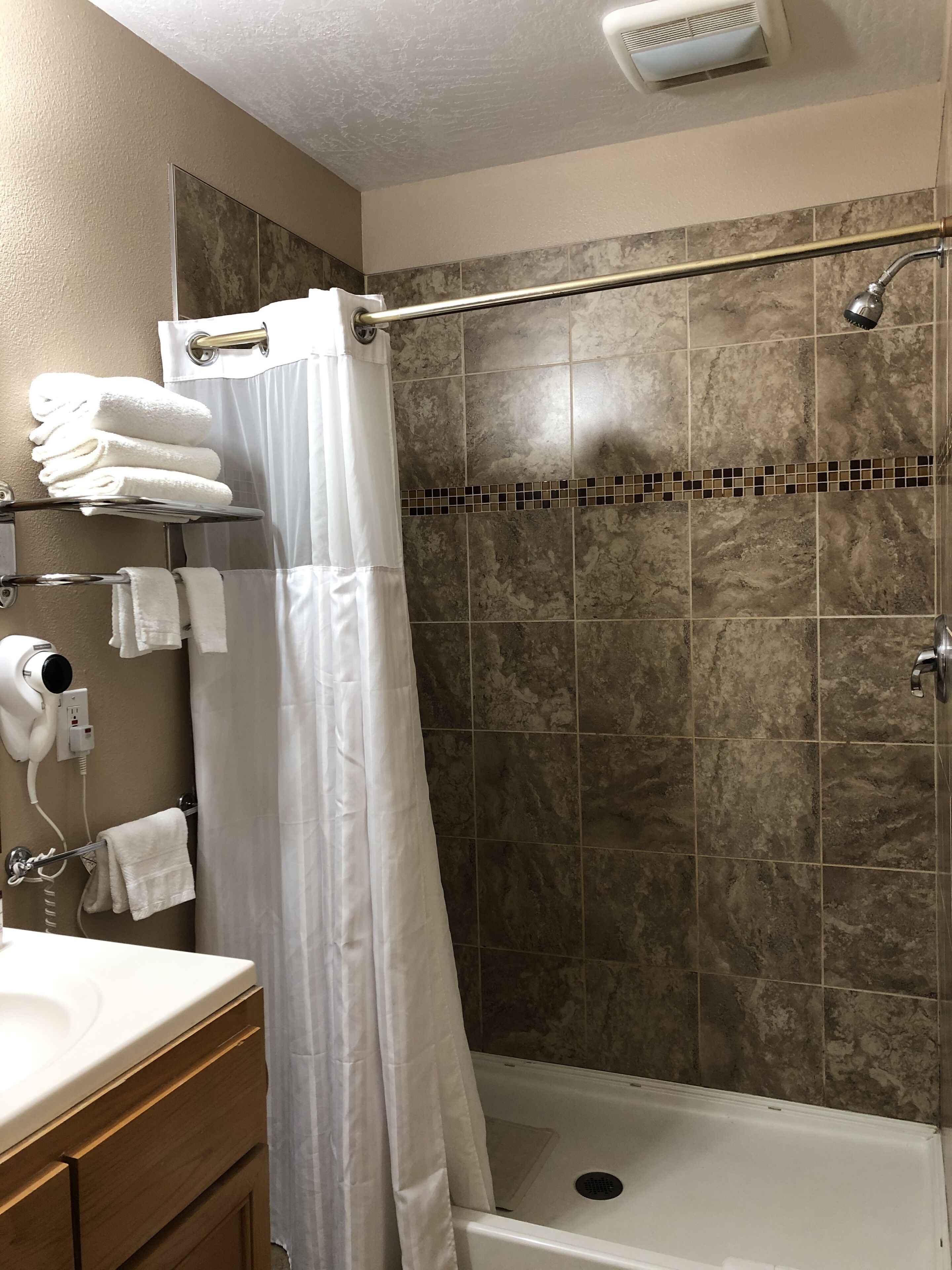 deluxe room, 1 king bed | bathroom shower